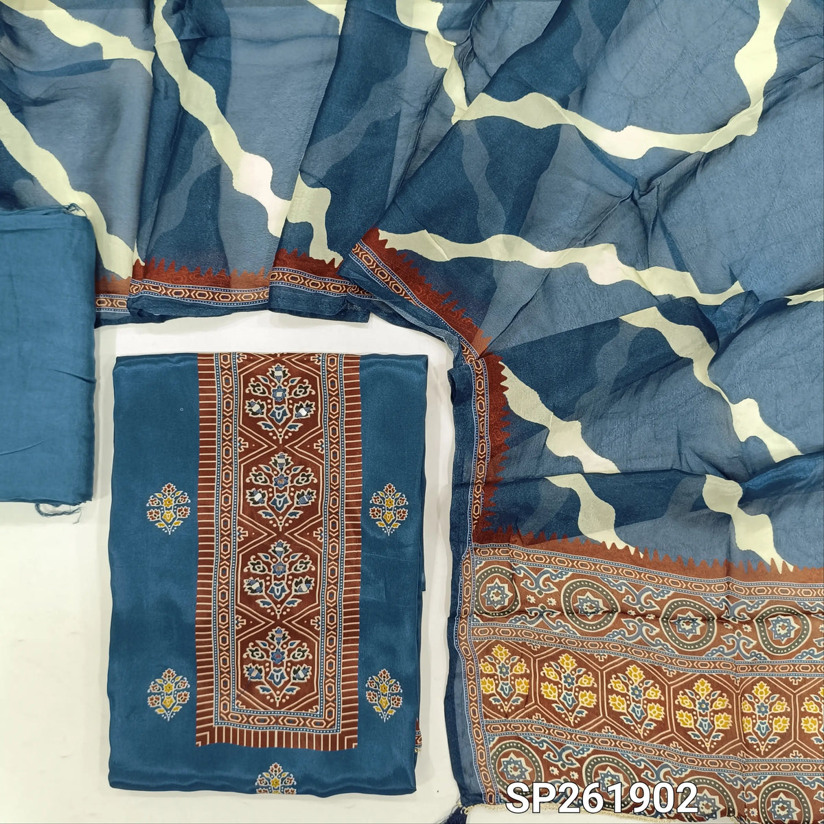 Indigo blue crepe silk unstitched salwar material, printed yoke with real mirror work, printed daman,(soft, shiny, lining needed)santoon bottom, printed short width chinon silk dupatta. SP261902