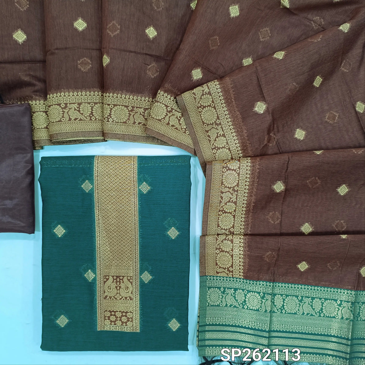 Teal blue silk cotton unstitched salwar material,benarasi zari weaving on front, rich weaving daman,(lining needed)dark brown silky bottom, zari weaving on silk cotton dupatta with contrast pallu and zari borders. SP262113