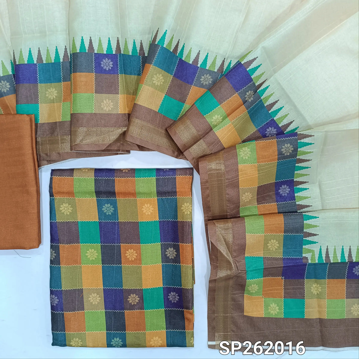 Multicoloured semi tussar unstitched salwar material, printed and checked design all over,(lining needed)brown semi tussar bottom,printed semi tussar dupatta with borders(TAPPING NEEDED). SP262016