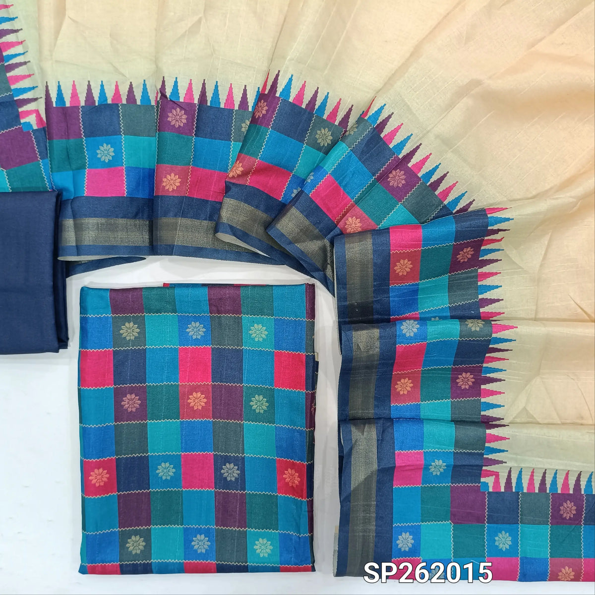 Multicoloured semi tussar unstitched salwar material, printed and checked design all over,(lining needed)blue semi tussar bottom,printed semi tussar dupatta with borders(TAPPING NEEDED). SP262015