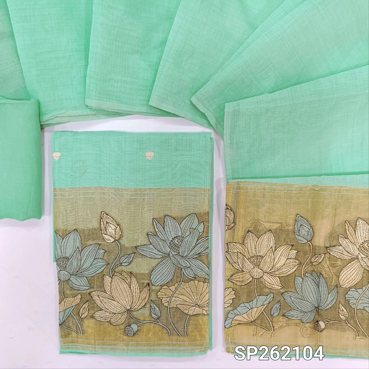 Sea green silk cotton unstitched salwar material,buttas on front,tissue borders with thread and zari embroidery on daman(Lining Needed)santoon bottom,silk cotton dupatta with gold tissue pallu with embroidery. SP262104
