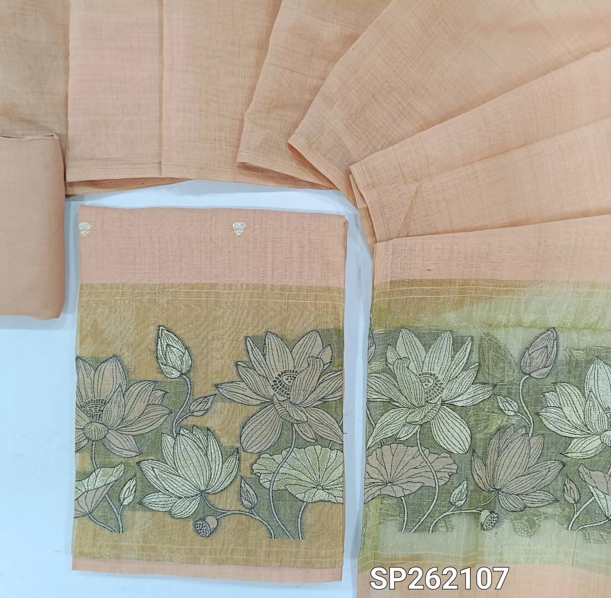 Peachish pink silk cotton unstitched salwar material,buttas on front,tissue borders with thread and zari embroidery on daman(Lining Needed)santoon bottom,silk cotton dupatta with gold tissue pallu with embroidery. SP262107