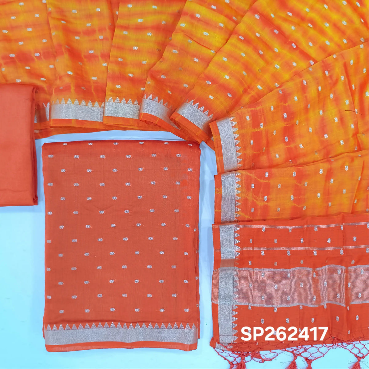 Bright orange premium uppada silk unstitched salwar material,zari buttas all over, (Lining Needed)premium silk bottom,buttas with shibori dyed on uppada silk dupatta with fancy tassles. SP262417