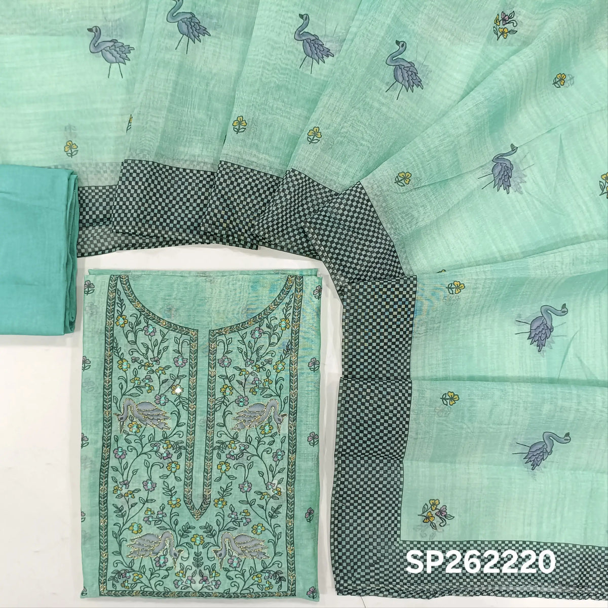 Pastel blue digital printed silk cotton unstitched salwar material,printed with zari and faux mirror work on yoke,printed daman,(lining needed)santoon bottom, digital printed silk cotton dupatta with contrast borders. SP262220