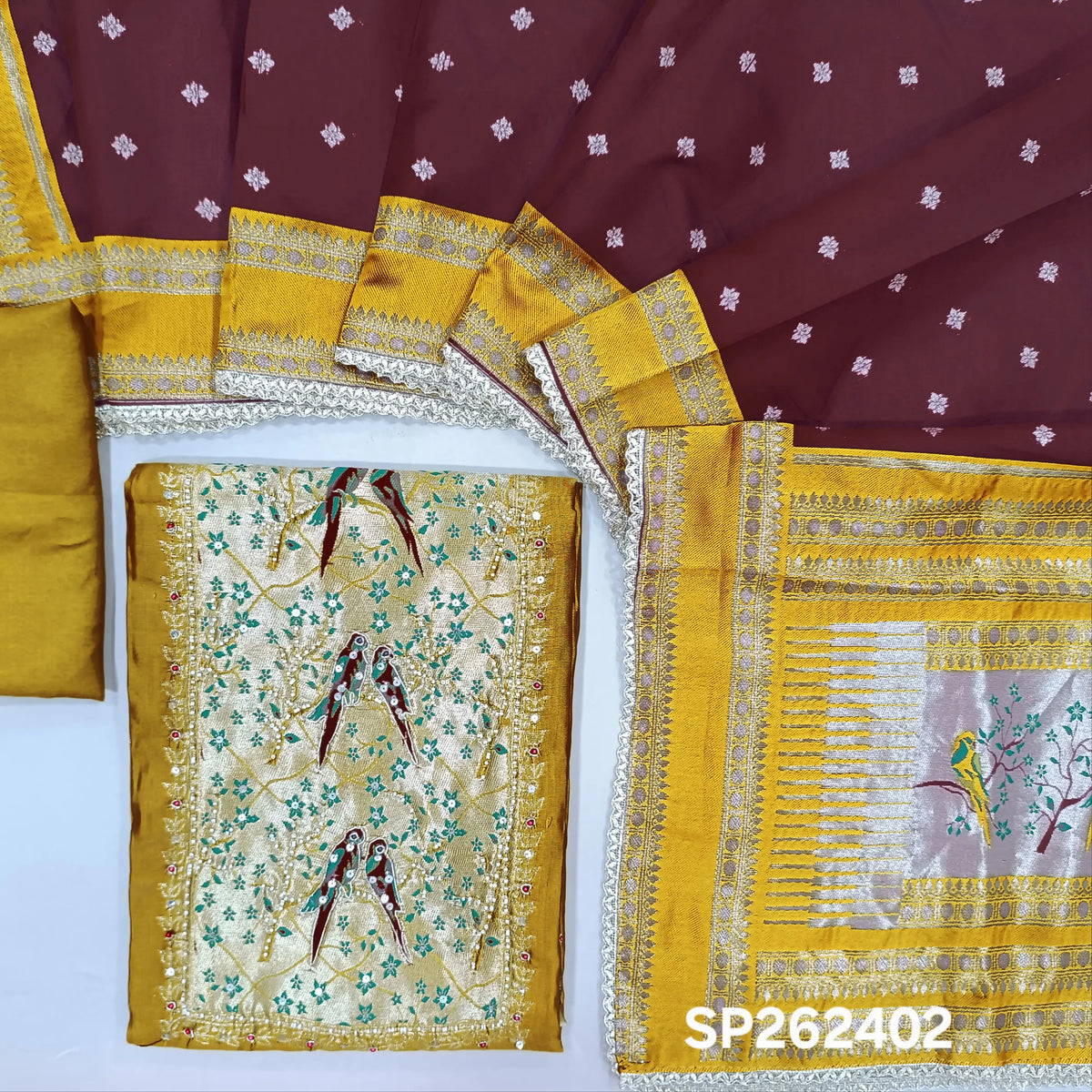 Mehandhi yellow silk cotton unstitched salwar material,rich weaving with pearl bead and sequins work on yoke,buttas on front,rich daman,(Lining Needed)spun cotton bottom, buttas on silk cotton dupatta with contrast borders & rich pallu. SP262402
