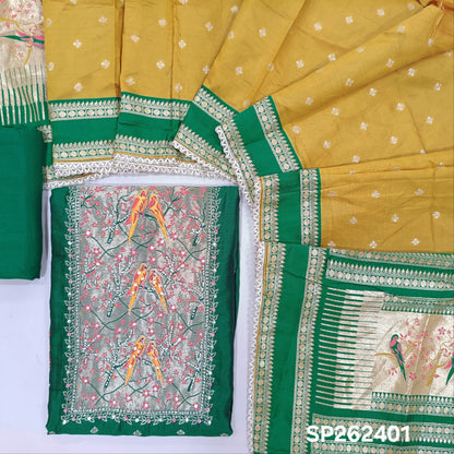 Bottle green silk cotton unstitched salwar material,rich weaving with pearl bead and sequins work on yoke,buttas on front,rich daman,(Lining Needed)spun cotton bottom, buttas on silk cotton dupatta with contrast borders & rich pallu. SP262401
