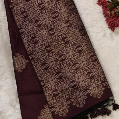 Dark brown semi tussar saree, with rich traditional zari weaving all over (thin, Textured) rich pallu, running blouse with zari woven buttas and borders. NS315