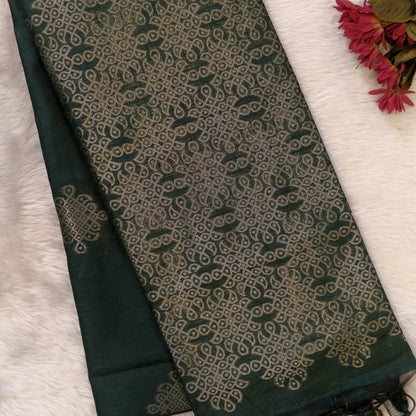 Dark green semi tussar saree, with rich traditional zari weaving all over (thin, Textured) rich pallu, running blouse with zari woven buttas and borders. NS314