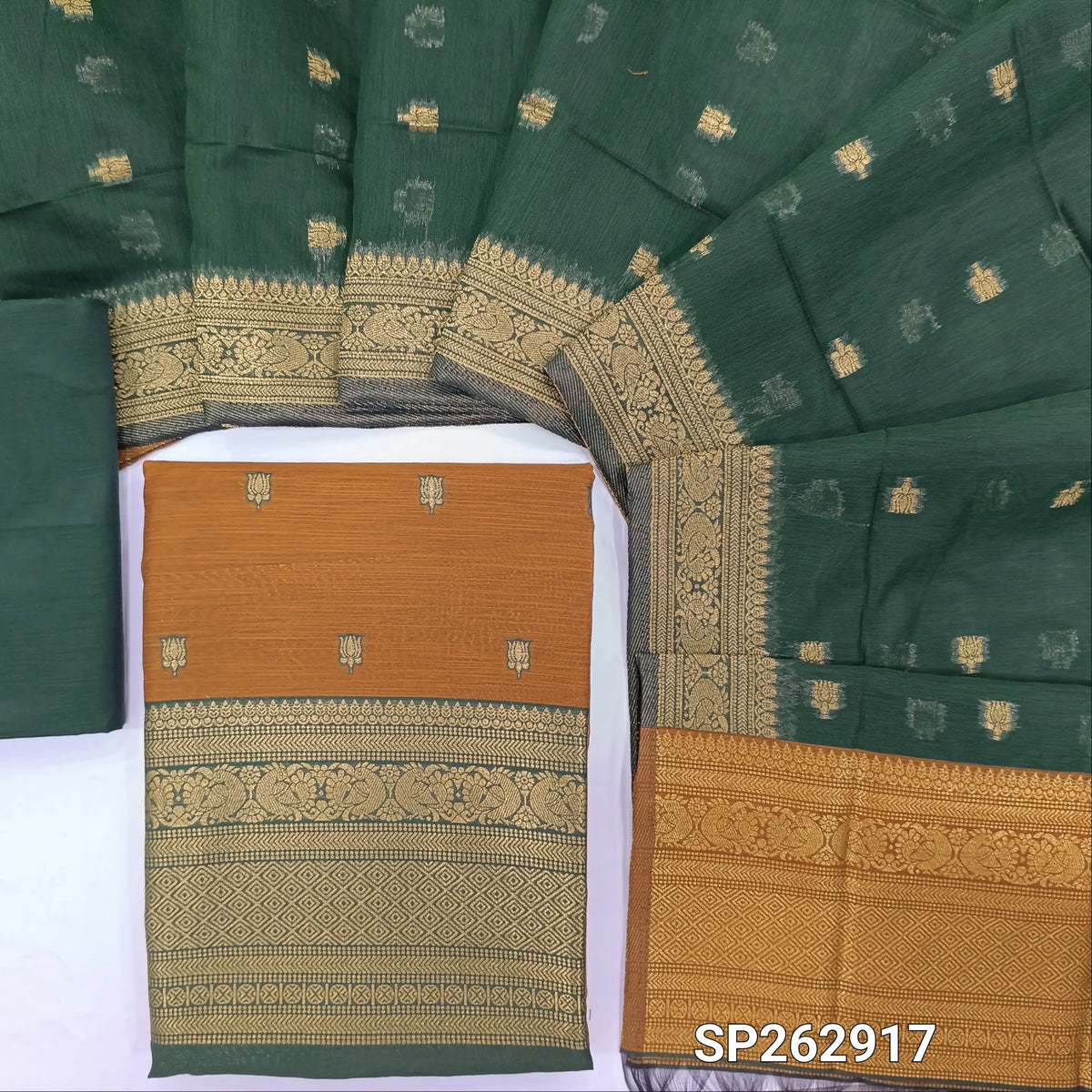 Honey brown premium silk cotton unstitched salwar material,buttas all over benarasi zari weaving daman, (lining needed)bottle green  silky bottom,buttas on dual shaded silk cotton dupatta with rich pallu and borders. SP262917
