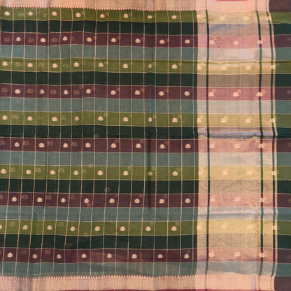 Multicoloured (Dark green & brown)soft silk cotton saree with zari woven checks & buttas all over, zari woven double side borders, tissue pallu,multicoloured running blouse with borders & buttas. NS27