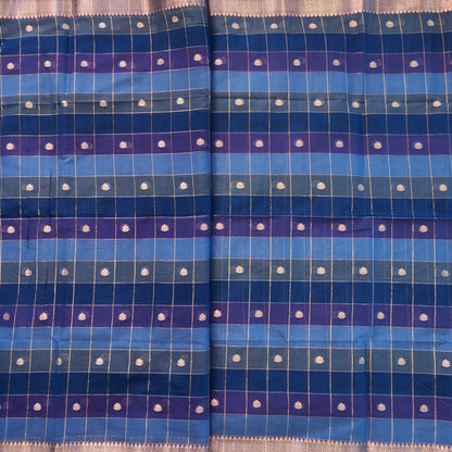 Multicoloured (Light& dark blue)soft silk cotton saree with zari woven checks & buttas all over, zari woven double side borders, tissue pallu,multicoloured running blouse with borders & buttas. NS32