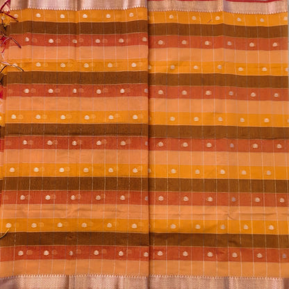 Multicoloured (Orange & yellow)soft silk cotton saree with zari woven checks & buttas all over, zari woven double side borders, tissue pallu,multicoloured running blouse with borders & buttas. NS25