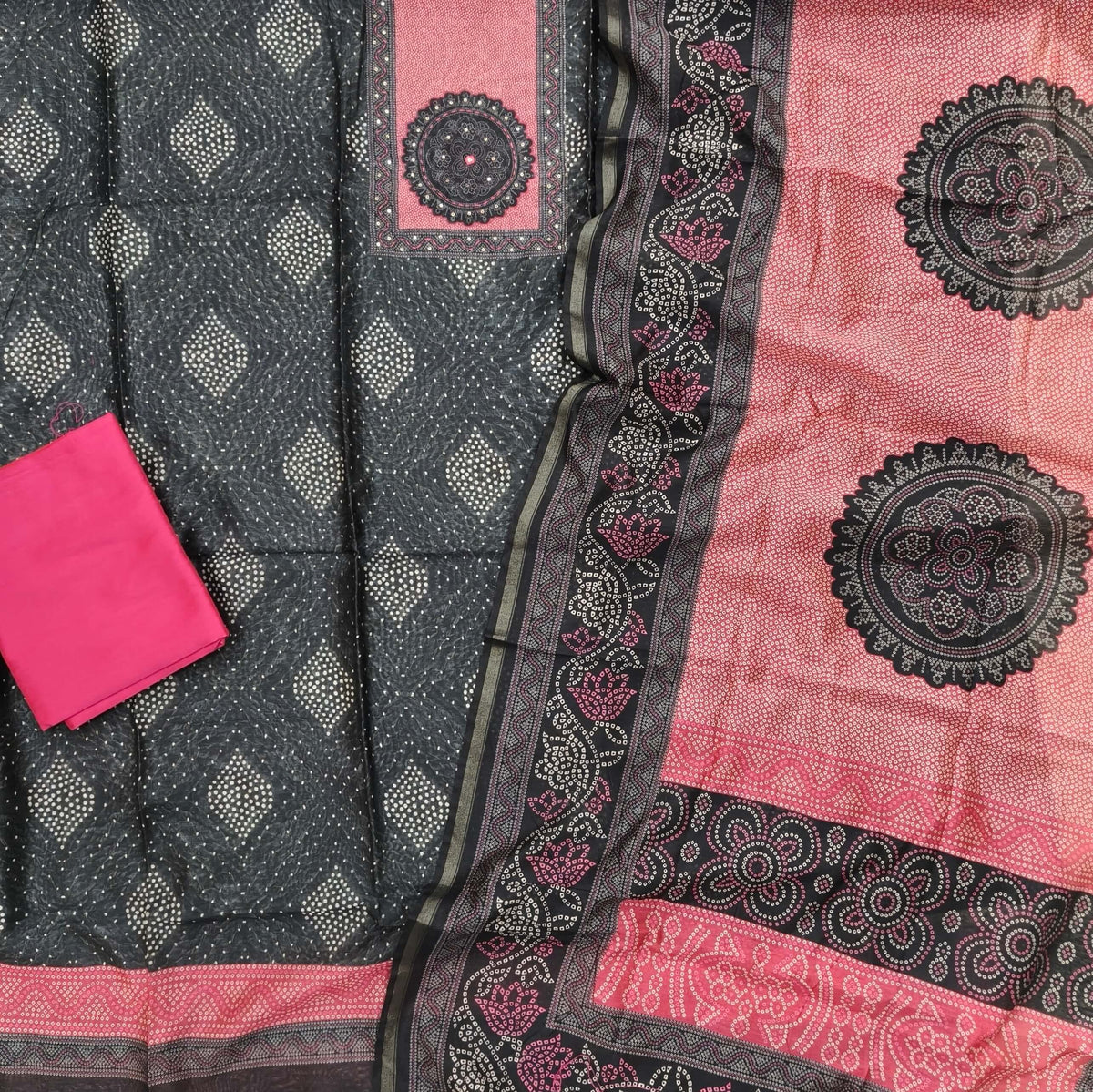 Black digital printed chanderi silk cotton unstitched salwar material, contrast printed yoke with thread work,(lining needed)pink silk cotton bottom,digital printed chanderi silk cotton dupatta with tissue borders. OC261703