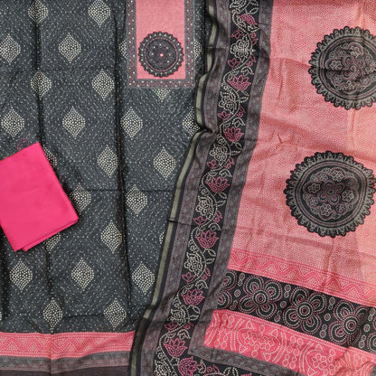 Black digital printed chanderi silk cotton unstitched salwar material, contrast printed yoke with thread work,(lining needed)pink silk cotton bottom,digital printed chanderi silk cotton dupatta with tissue borders. OC261703