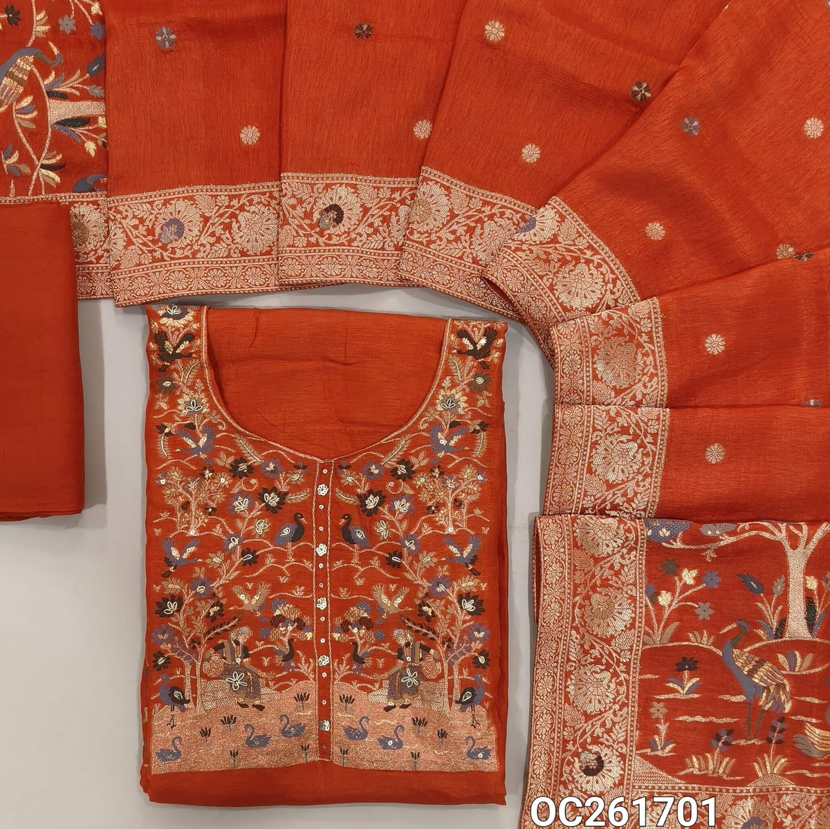 Rust orange pure uppada silk unstitched salwar material, round neck, zarodzi, zari woven and sequins on yoke,rich daman border,(lining needed)santoon bottom,pure uppada silk with rich Meenakari weaving dupatta with pallu.(DRY CLEAN ONLY)OC261701