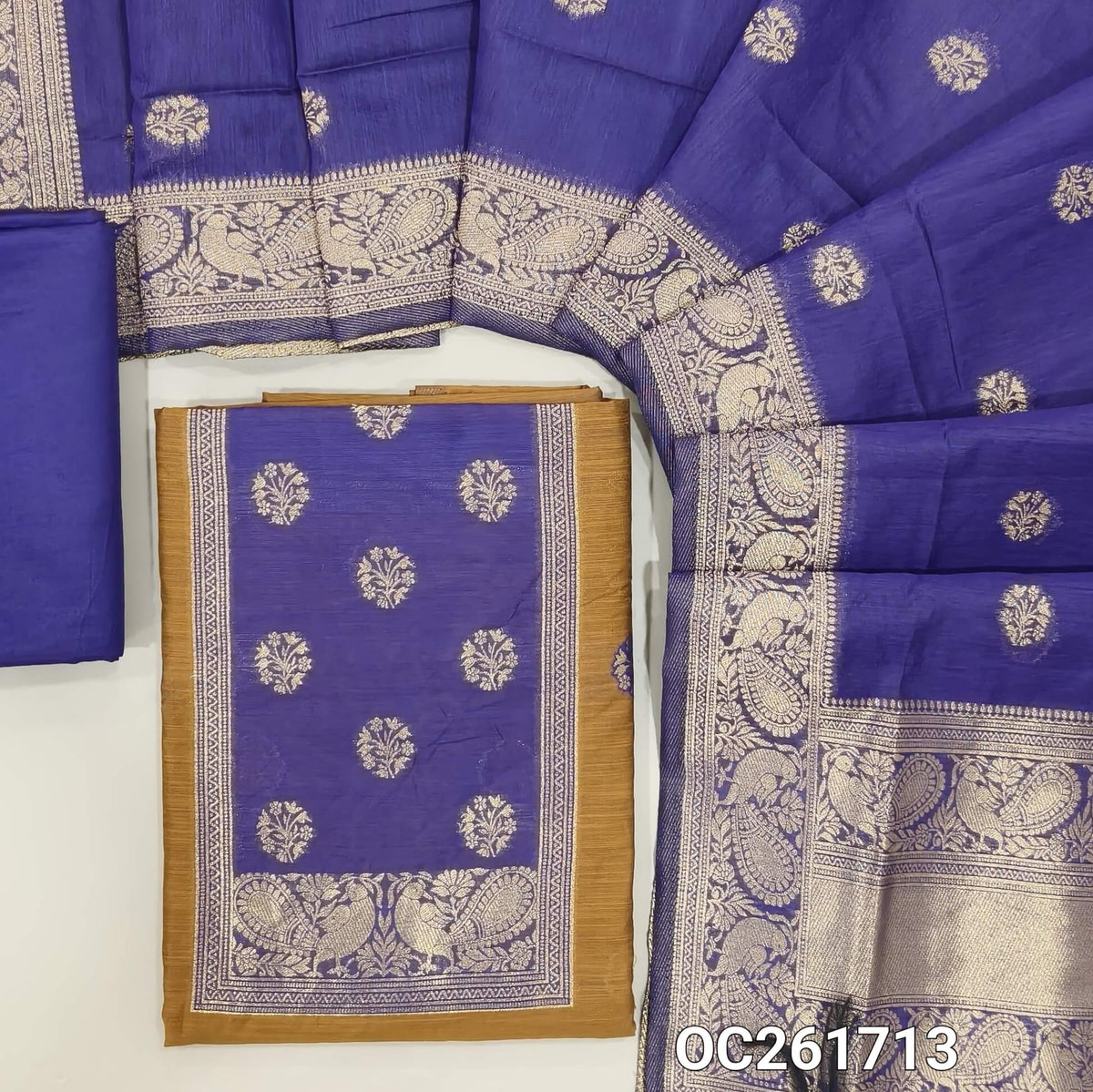Honey brown benarasi zari woven premium silk cotton unstitched salwar material,buttas on front, zari weaving on yoke, rich daman(Lightweight, Lining Needed)violet silky bottom, benarasi zari woven silk cotton dupatta with borders. OC261713