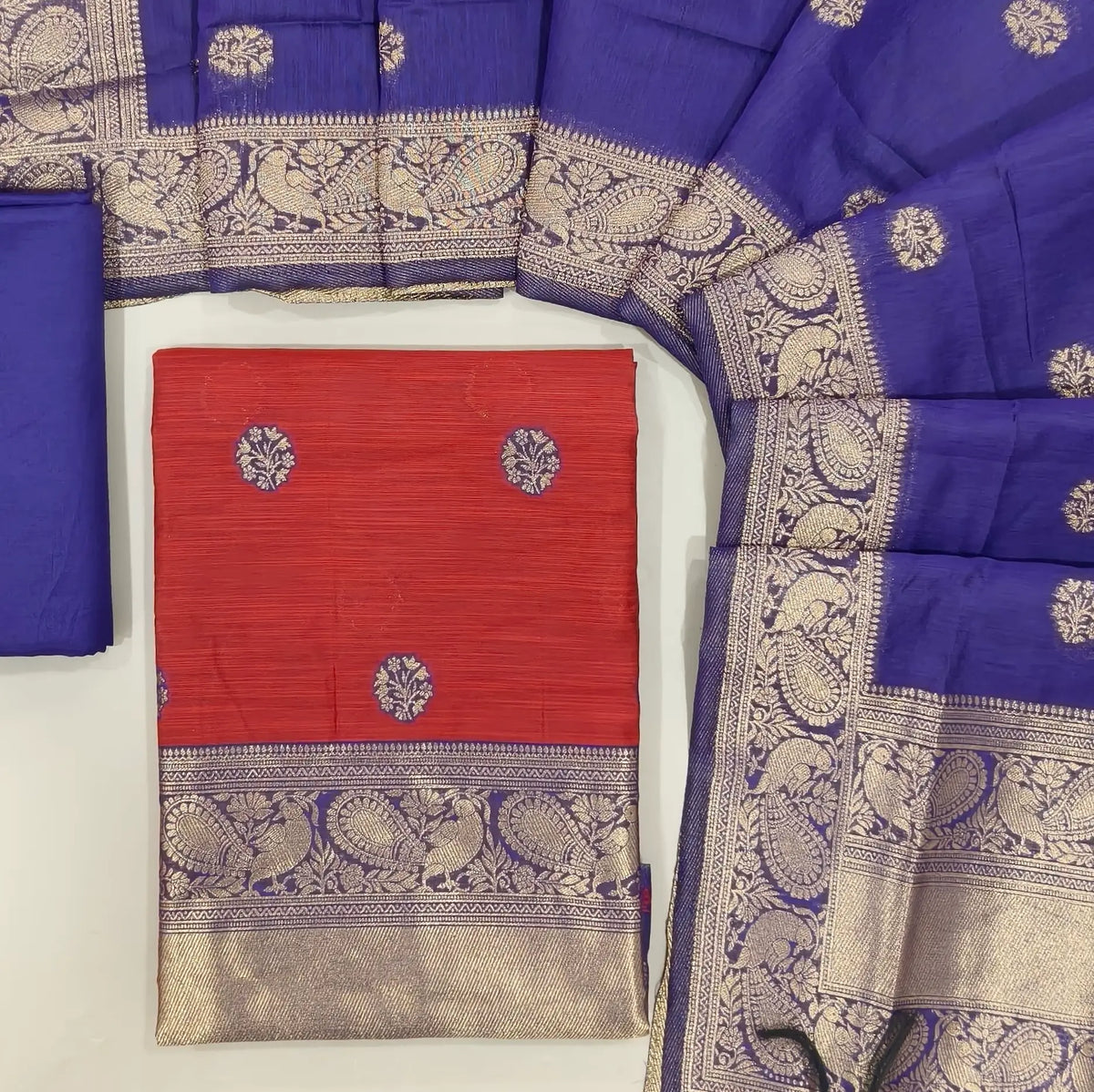 Maroon benarasi zari woven premium silk cotton unstitched salwar material,buttas on front, zari weaving on yoke, rich daman(Lightweight, Lining Needed)violet silky bottom, benarasi zari woven silk cotton dupatta with borders. OC261715