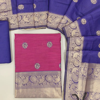 Rani pink benarasi zari woven premium silk cotton unstitched salwar material,buttas on front, zari weaving on yoke, rich daman(Lightweight, Lining Needed)violet silky bottom, benarasi zari woven silk cotton dupatta with borders. OC261712