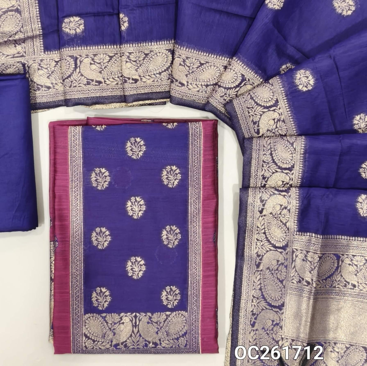 Rani pink benarasi zari woven premium silk cotton unstitched salwar material,buttas on front, zari weaving on yoke, rich daman(Lightweight, Lining Needed)violet silky bottom, benarasi zari woven silk cotton dupatta with borders. OC261712