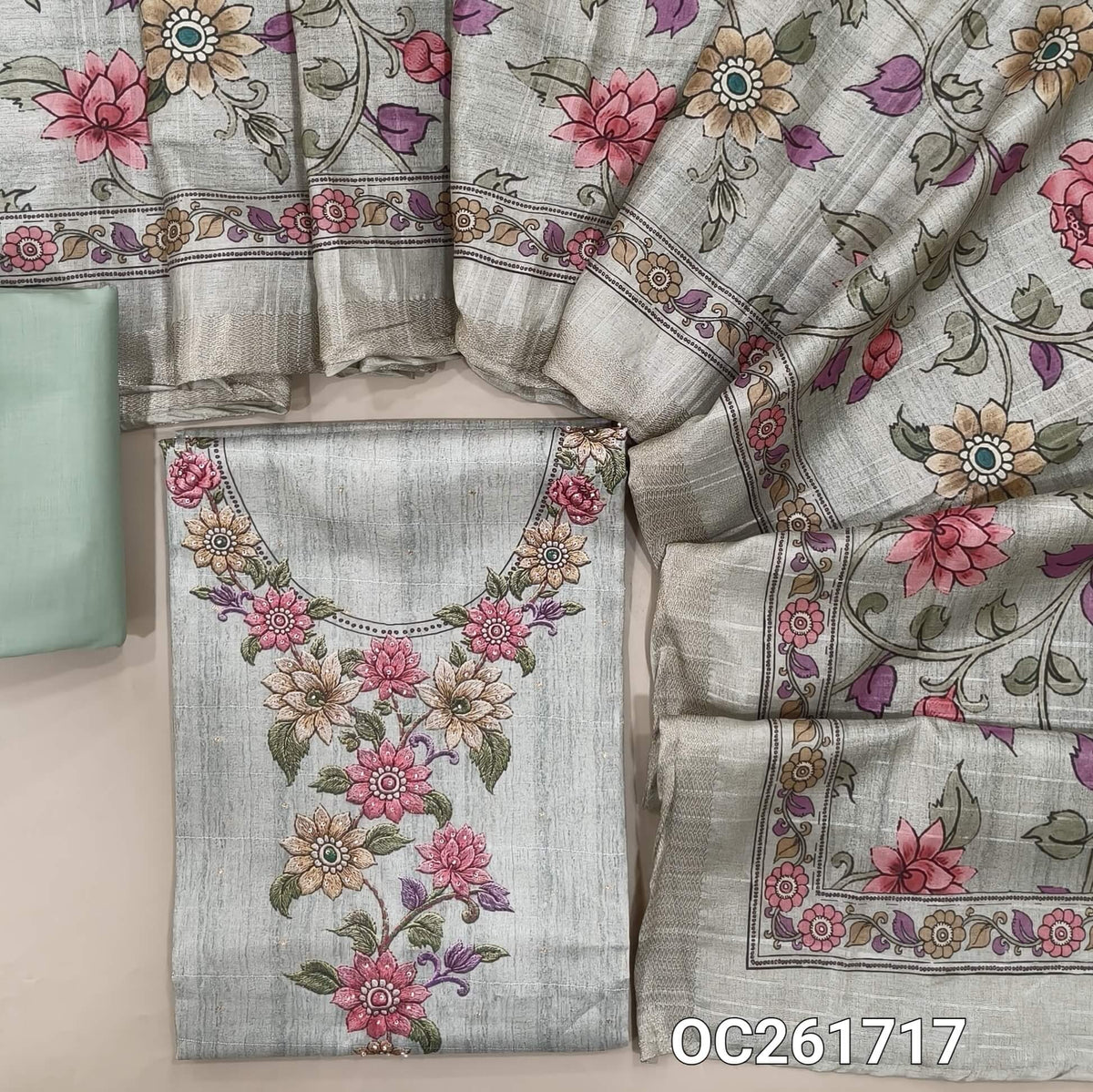 Sea green semi tussar unstitched salwar material,printed yoke with sugar bead work, zari buttas all over, (lining needed)spun cotton bottom, digital printed semi tussar dupatta with zari borders. OC261717