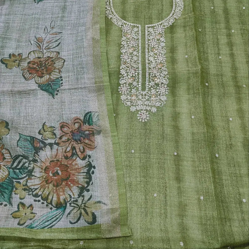Traditional embroidered fabric with floral print and white neckline design on olive green salwar material