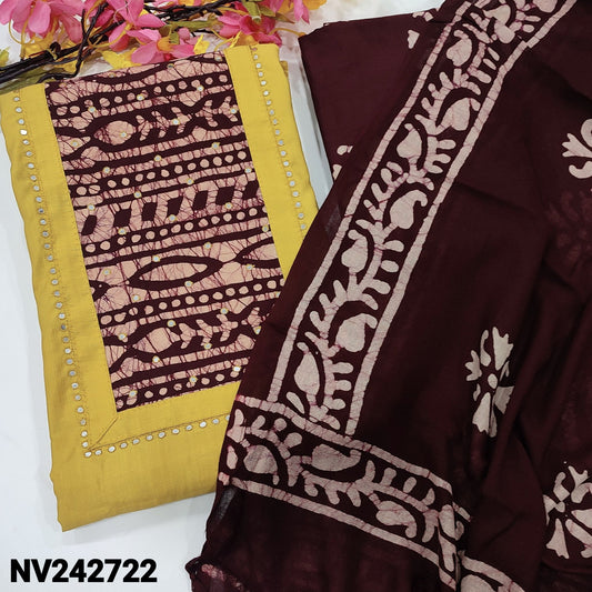 CODE NV242722 : Mehandhi yellow soft silk cotton unstitched salwar material, batik dyed yoke patch with faux mirror work(lining needed)dark maroon batik dyed pure cotton bottom, batik dyed fancy soft silk cotton dupatta with tassels.