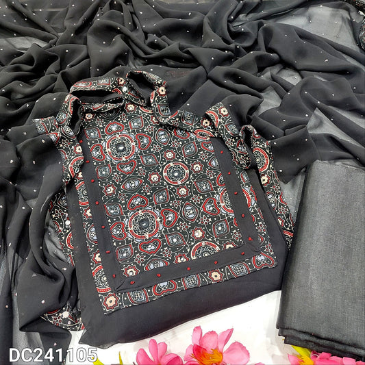 CODE DC241105 : Black semi georgette unstitched salwar material, ajrak printed yoke with real mirror work(lining needed)matching silky fabric provided for both bottom &lining, glitter dew drop work on semi georgette dupatta.