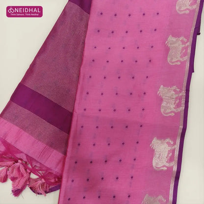 Pink with beetroot purple fancy silk cotton saree with thread woven buttas all over the body of the saree, double side borders with pichwai zari short pallu and zari striped blouse with cow motif weaving. CODE NS07