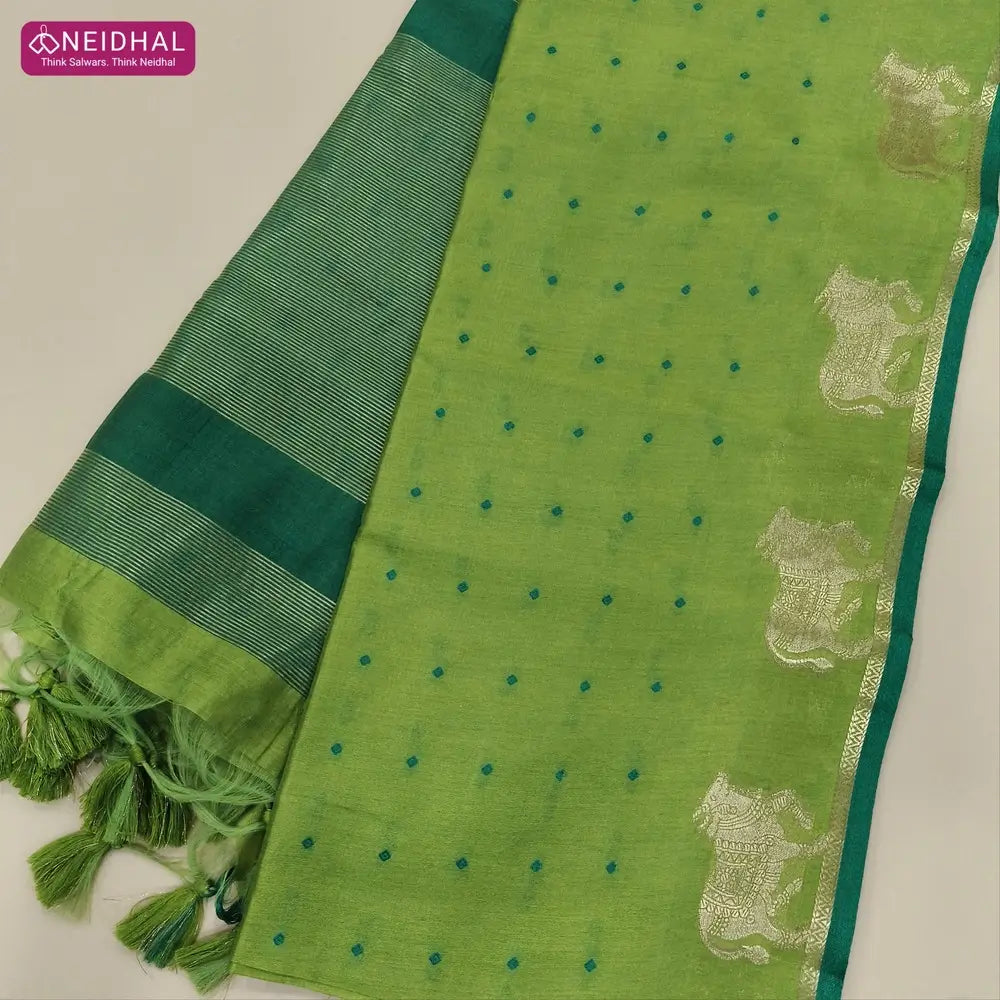 Light green with turquoise green fancy silk cotton saree with thread woven buttas all over the body of the saree, double side borders with pichwai zari short pallu and zari striped blouse with cow motif weaving. CODE NS06