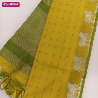 Mehandhi yellow with mossy green fancy silk cotton saree with thread woven buttas all over the body of the saree, double side borders with pichwai zari short pallu and zari striped blouse with cow motif weaving. CODE NS03