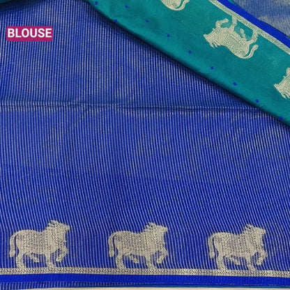 Teal green with royal blue fancy silk cotton saree with thread woven buttas all over the body of the saree, double side borders with pichwai zari short pallu and zari striped blouse with cow motif weaving. CODE NS04