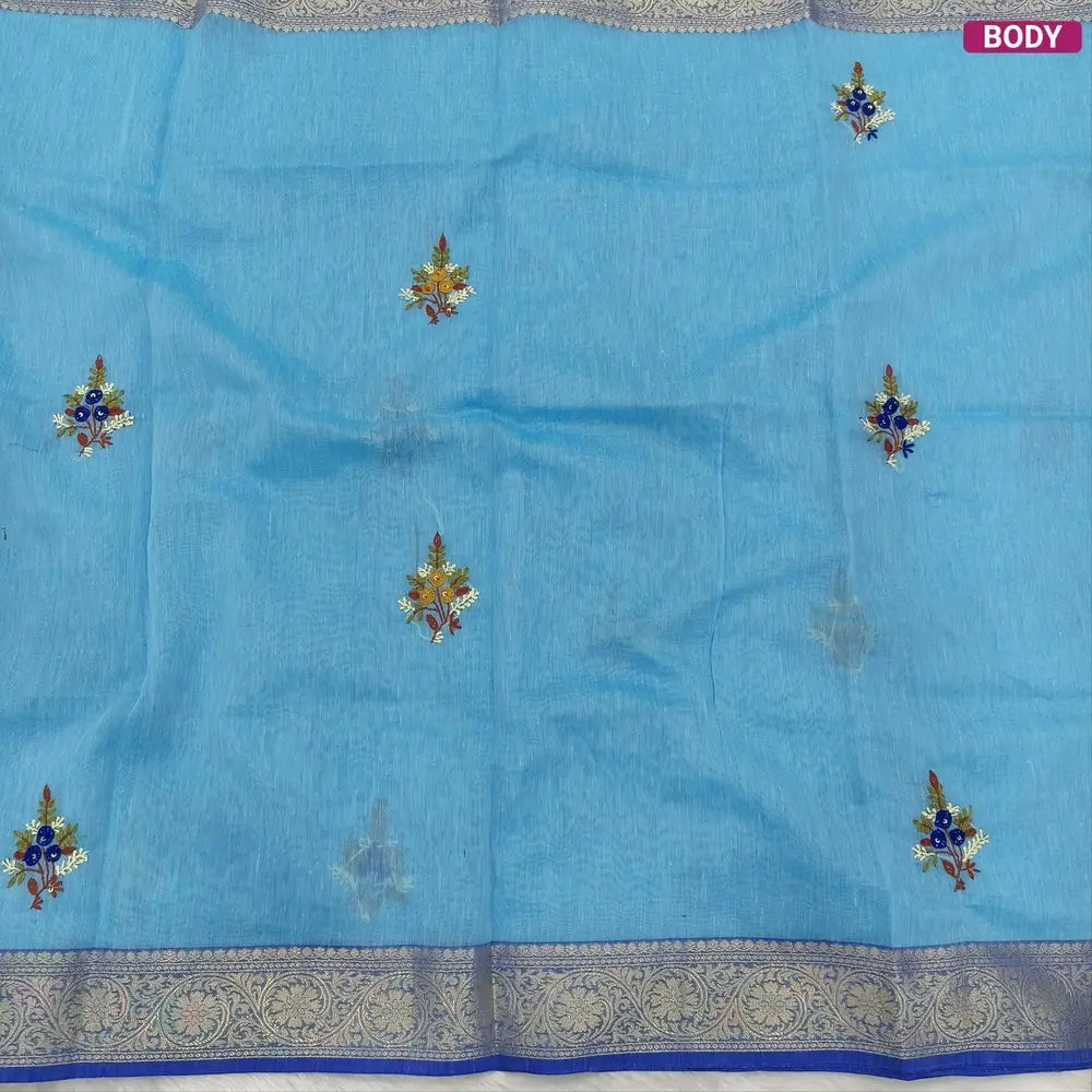 Designer sky blue premium slub silk cotton saree, rich hand embroidery work on body and pallu, matching zari tissue striped blouse. NS11