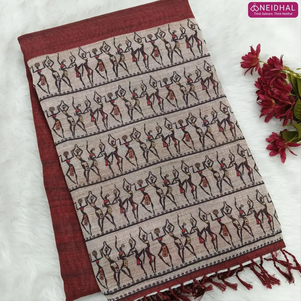 Dark Maroon semi linen saree(thin& light weight) warli print& silver tissue on borders, warli printed pallu with tassels, plain running blouse with silver tissue borders. NS34