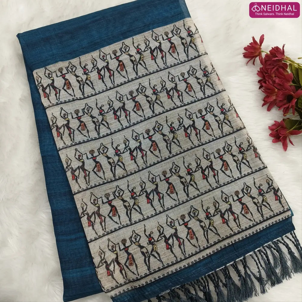 Dark teal Blue semi linen saree(thin& light weight) warli print& silver tissue on borders, warli printed pallu with tassels, plain running blouse with silver tissue borders. NS38