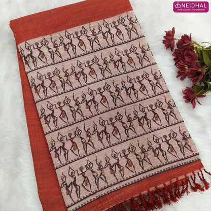 Brick Red semi linen saree(thin& light weight) warli print& silver tissue on borders, warli printed pallu with tassels, plain running blouse with silver tissue borders. NS39