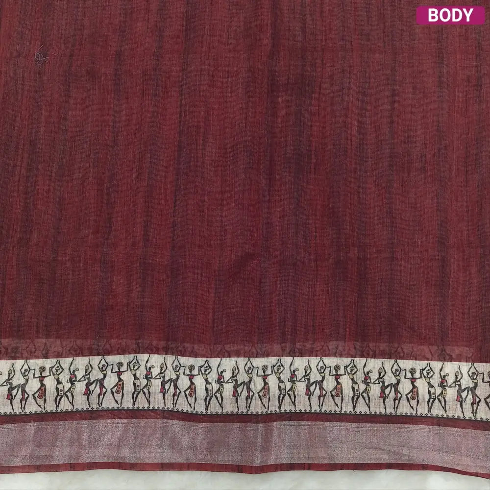 Dark Maroon semi linen saree(thin& light weight) warli print& silver tissue on borders, warli printed pallu with tassels, plain running blouse with silver tissue borders. NS34