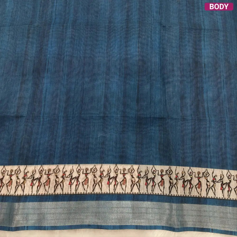 Dark teal Blue semi linen saree(thin& light weight) warli print& silver tissue on borders, warli printed pallu with tassels, plain running blouse with silver tissue borders. NS38