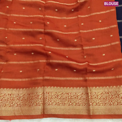 Navy Blue fancy silk saree (soft, silky) with banarasi zari woven double side borders zari woven butttas and stripes allover, contrast zari woven pallu, rust orange zari woven blouse with borders. NS44