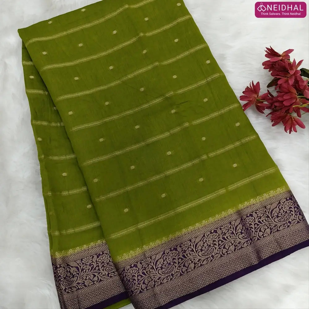 Mossy Green fancy silk saree (soft, silky) with banarasi zari woven double side borders zari woven butttas and stripes allover, contrast zari woven pallu, dark purple zari woven blouse with borders. NS43