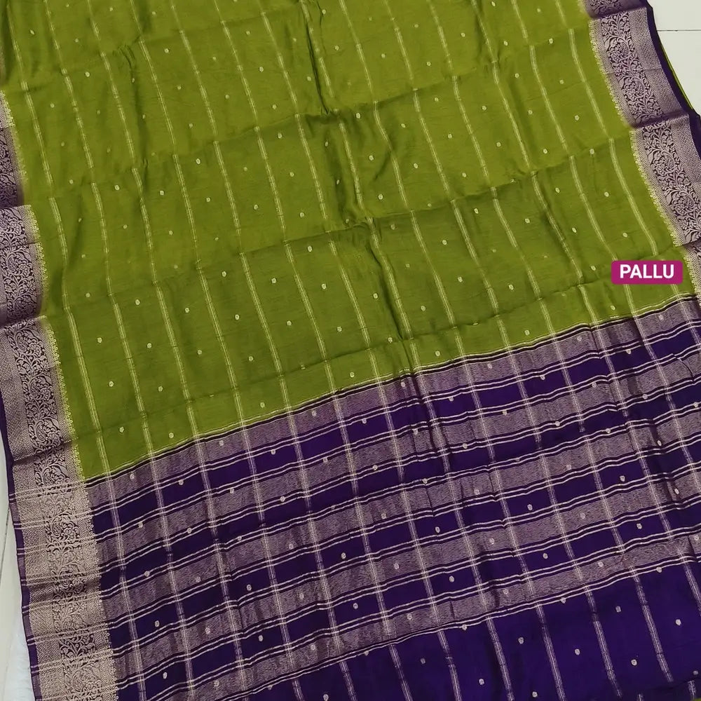 Mossy Green fancy silk saree (soft, silky) with banarasi zari woven double side borders zari woven butttas and stripes allover, contrast zari woven pallu, dark purple zari woven blouse with borders. NS43
