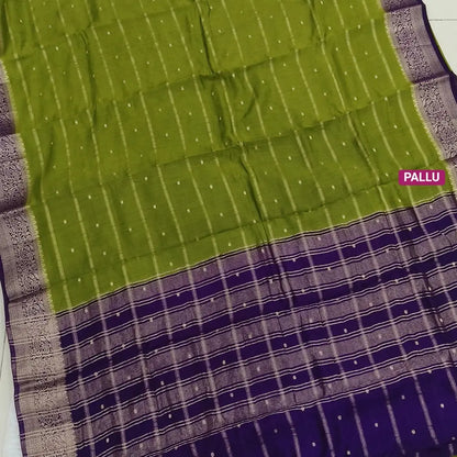 Mossy Green fancy silk saree (soft, silky) with banarasi zari woven double side borders zari woven butttas and stripes allover, contrast zari woven pallu, dark purple zari woven blouse with borders. NS43
