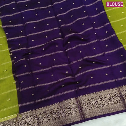 Mossy Green fancy silk saree (soft, silky) with banarasi zari woven double side borders zari woven butttas and stripes allover, contrast zari woven pallu, dark purple zari woven blouse with borders. NS43
