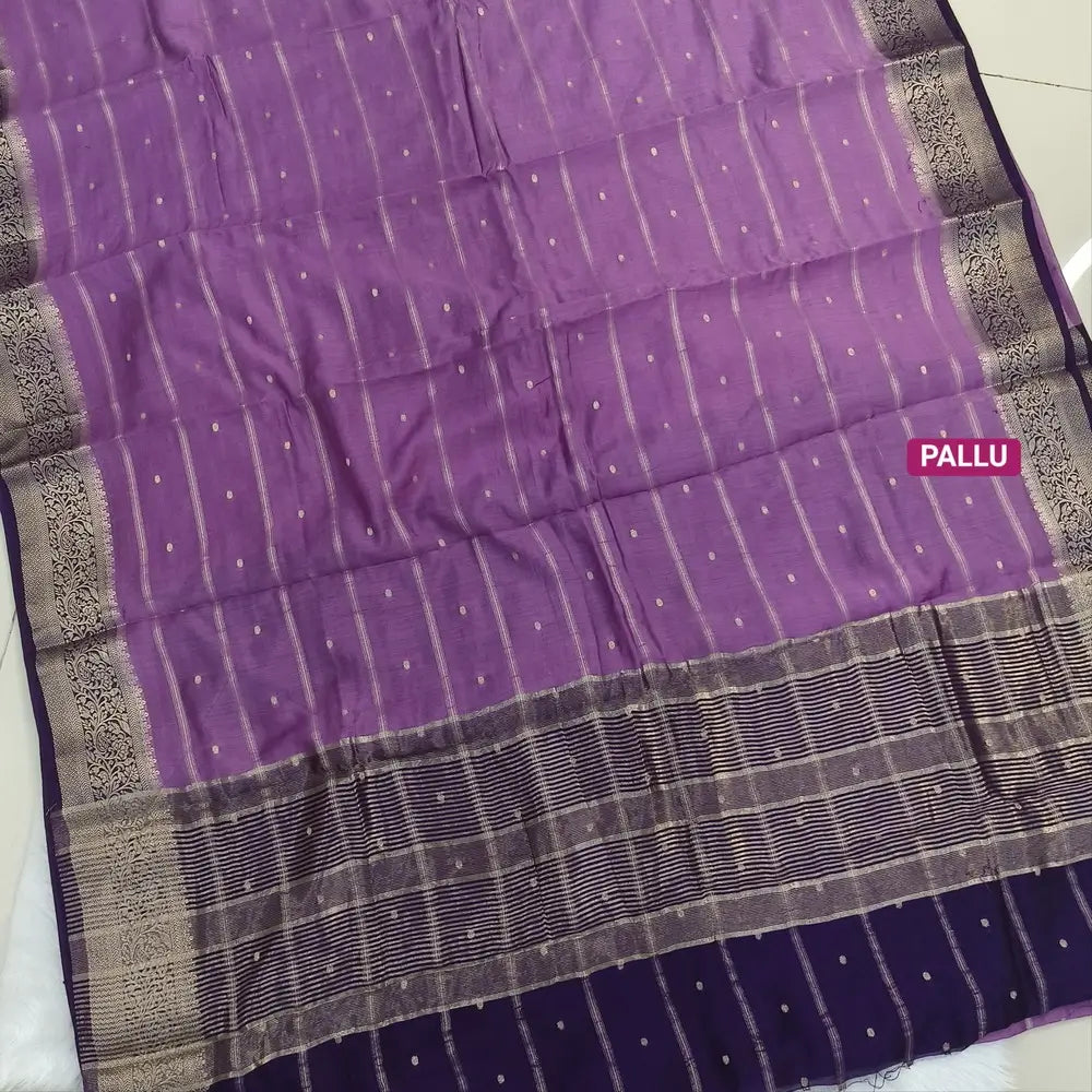 Lilac fancy silk saree (soft, silky) with banarasi zari woven double side borders zari woven butttas and stripes allover, contrast zari woven pallu, dark purple zari woven blouse with borders. NS42