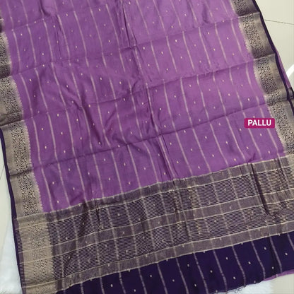 Lilac fancy silk saree (soft, silky) with banarasi zari woven double side borders zari woven butttas and stripes allover, contrast zari woven pallu, dark purple zari woven blouse with borders. NS42
