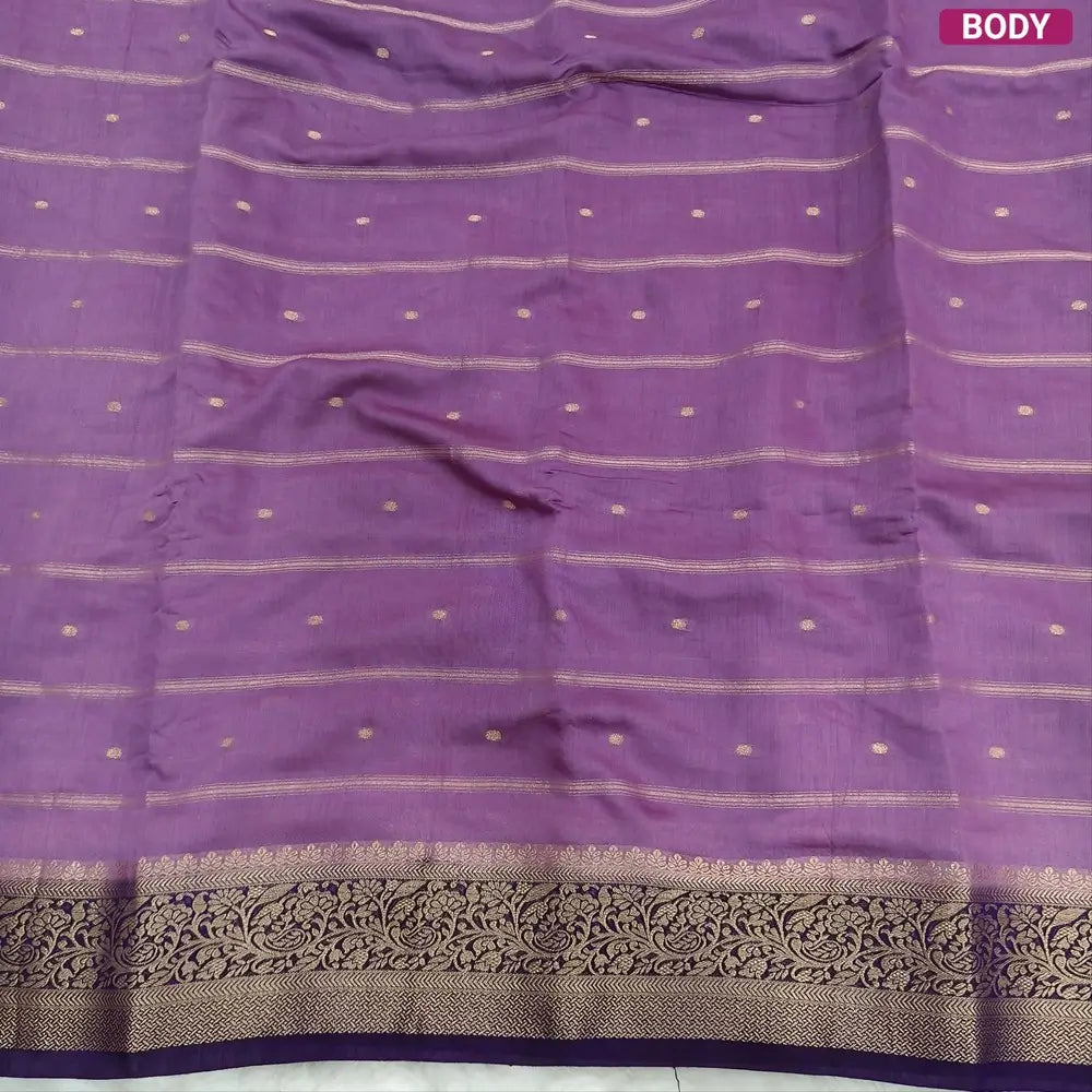 Lilac fancy silk saree (soft, silky) with banarasi zari woven double side borders zari woven butttas and stripes allover, contrast zari woven pallu, dark purple zari woven blouse with borders. NS42