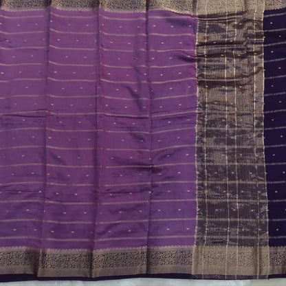 Lilac fancy silk saree (soft, silky) with banarasi zari woven double side borders zari woven butttas and stripes allover, contrast zari woven pallu, dark purple zari woven blouse with borders. NS42