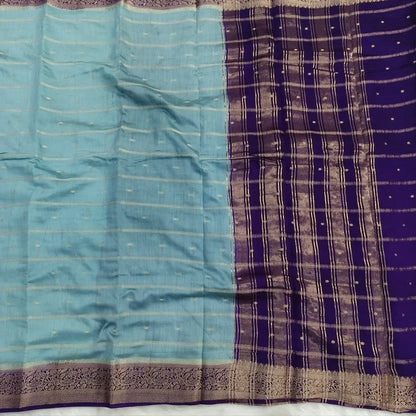 Pastel Blue fancy silk saree (soft, silky) with banarasi zari woven double side borders zari woven butttas and stripes allover, contrast zari woven pallu, dark purple zari woven blouse with borders. NS41