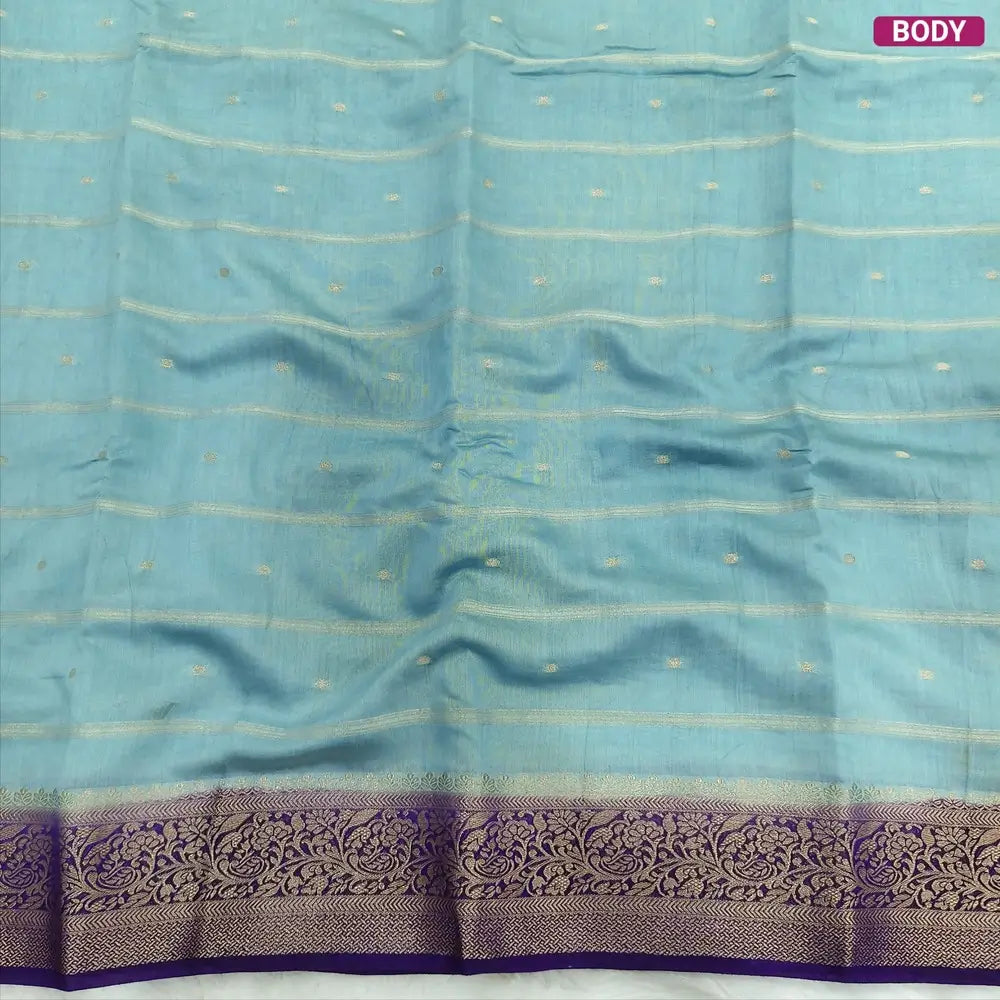Pastel Blue fancy silk saree (soft, silky) with banarasi zari woven double side borders zari woven butttas and stripes allover, contrast zari woven pallu, dark purple zari woven blouse with borders. NS41