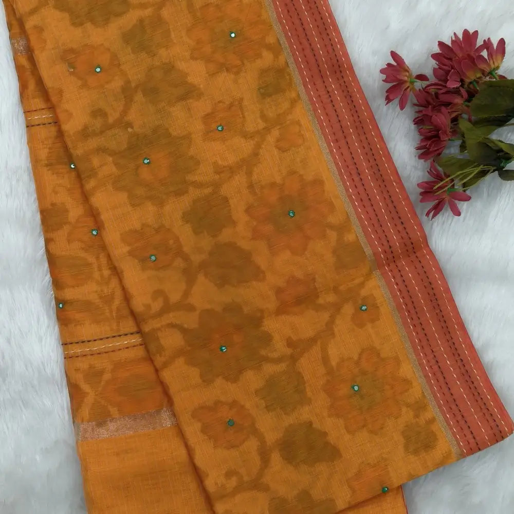 Light orange with golden tint printed soft silk cotton saree (lightweight, thin, soft) double side borders with kantha stitch detailing, printed pallu with thread embroidery and simple tassels, plain running blouse with borders. NS49