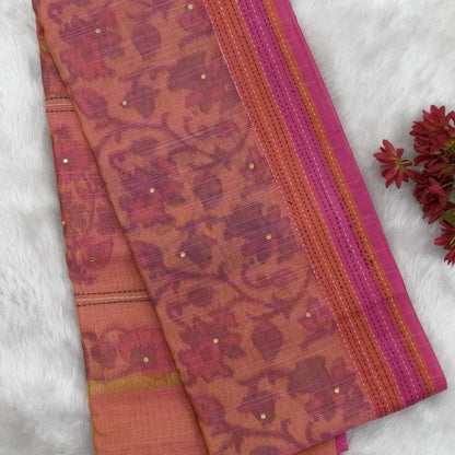 Light peachish pink with golden tint printed soft silk cotton saree (lightweight, thin, soft) double side borders with kantha stitch detailing, printed pallu with thread embroidery and simple tassels, plain running blouse with borders. NS50
